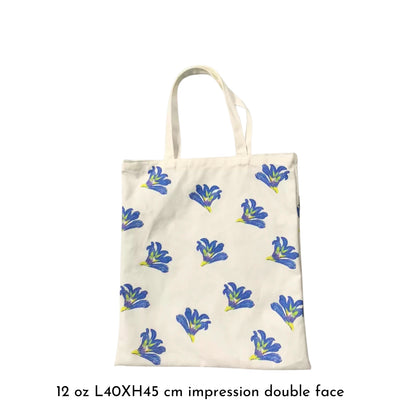 Détail du Tote Bag Babiana, fleurs Babiana imprimées et couture raffinée visible